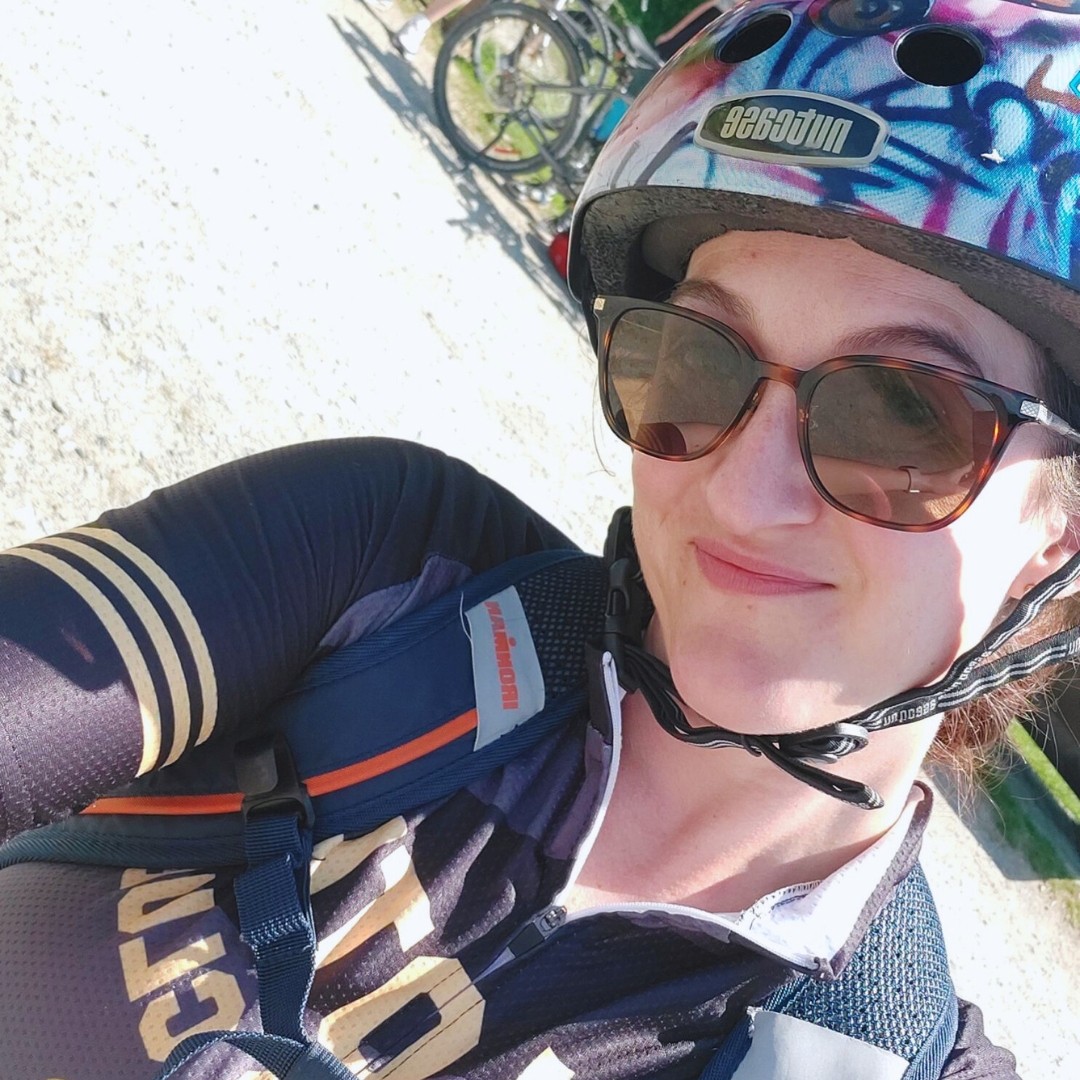 women taking selfie with bike helmet and sunglasses on 