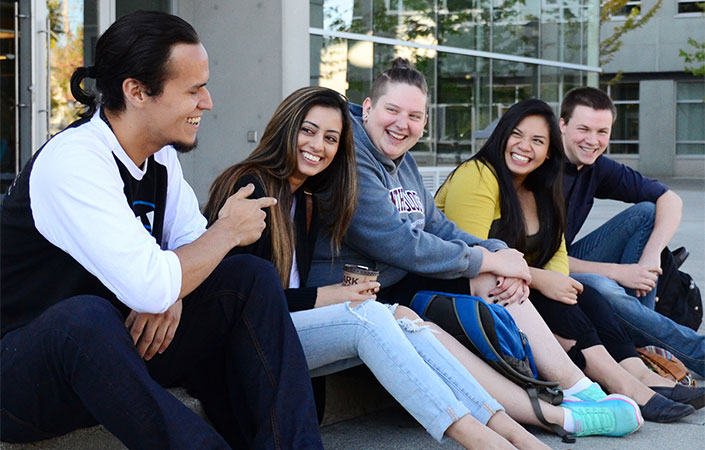 kpu students sitting outside a campus in Surrey, British Columbia