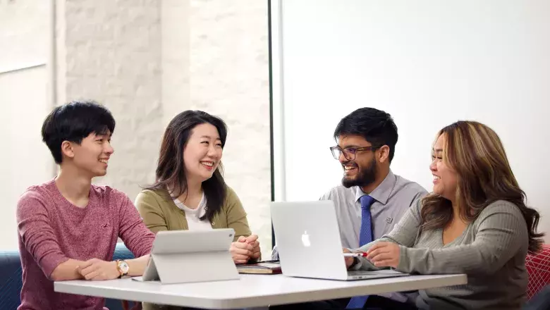 People in discussion around table