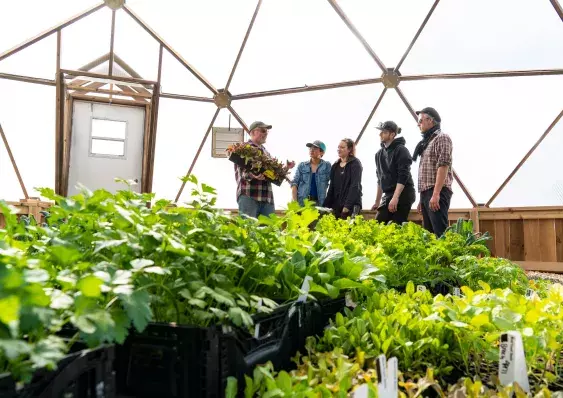 Students and Instructor in a Green House