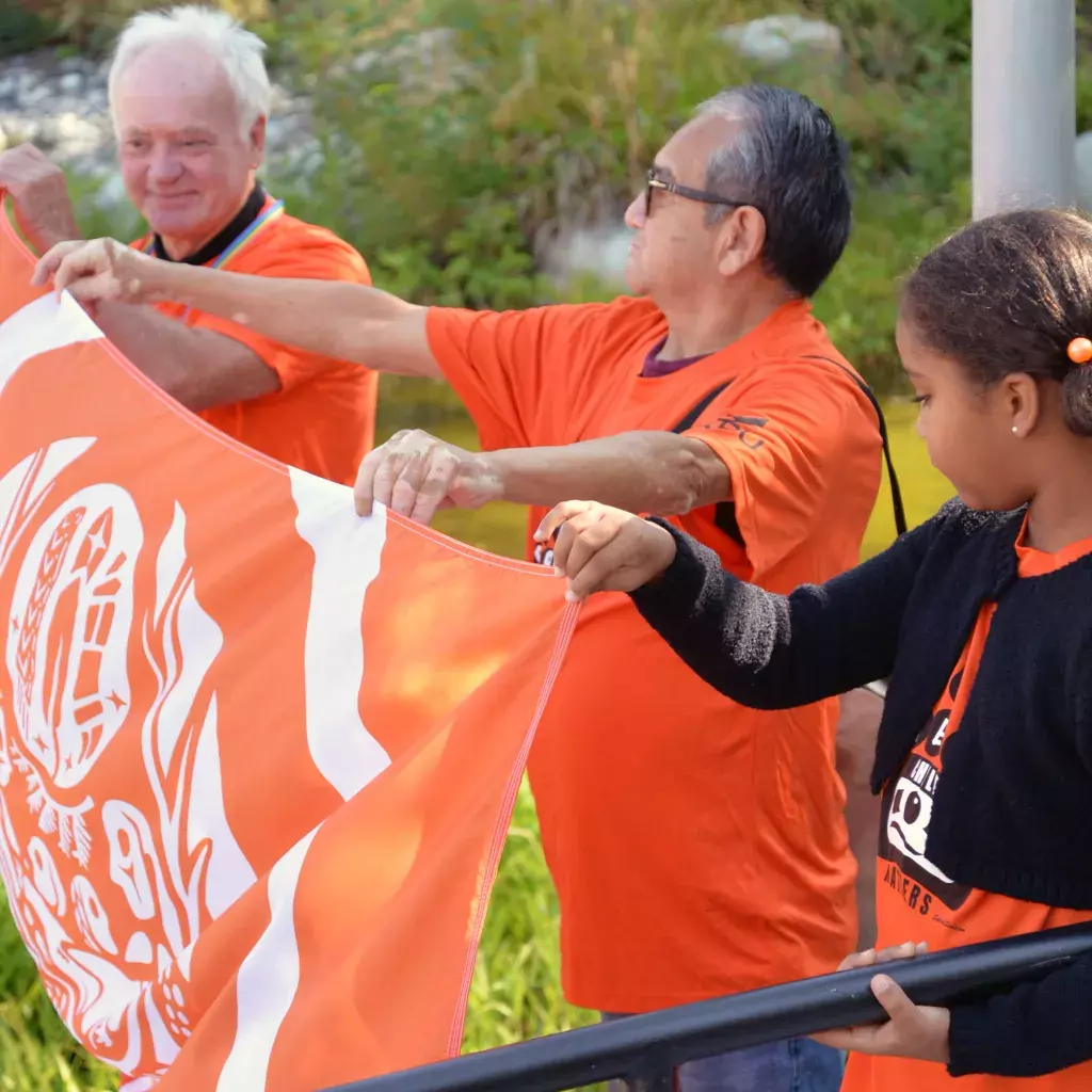 Dr. Alan Davis is joined by Elder in Residence Lekeyten by holding the orange flag