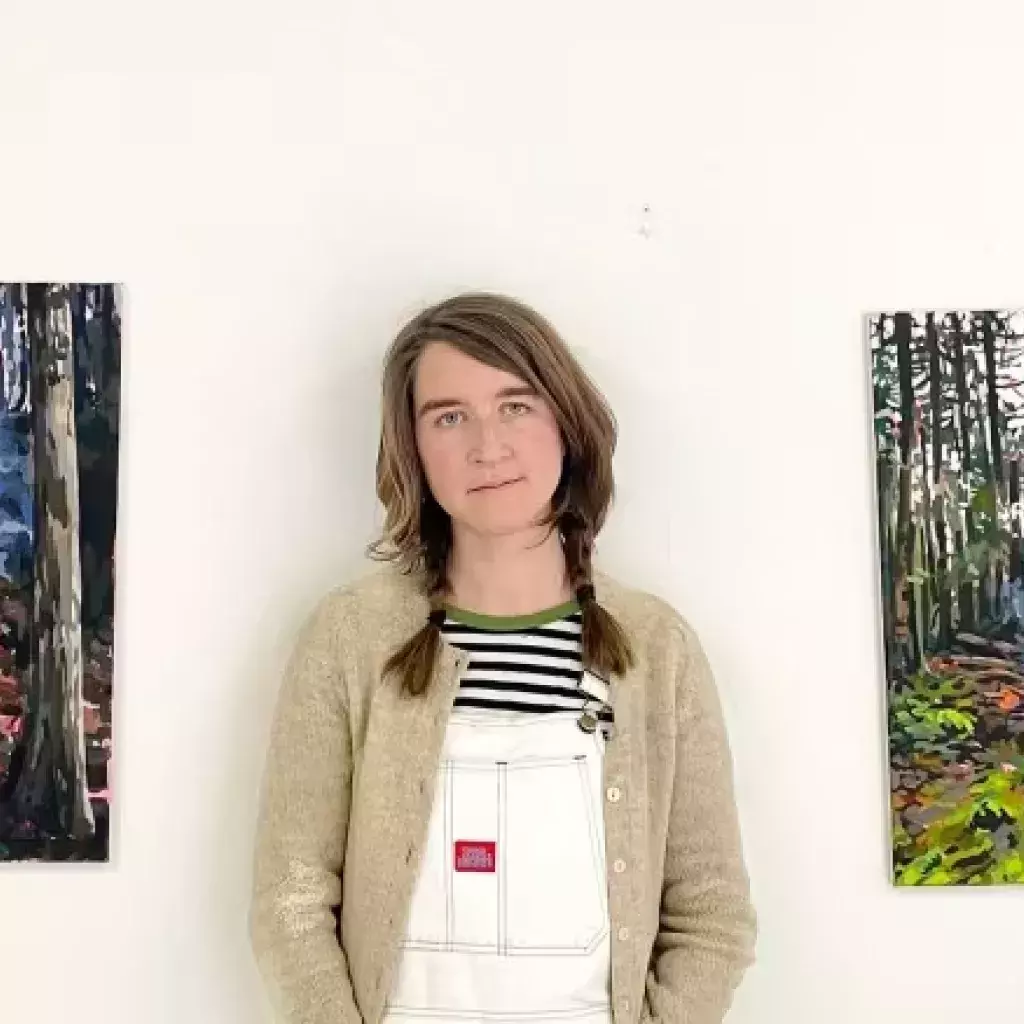 KPU instructor Liz Toohey-Wiese next to her art.