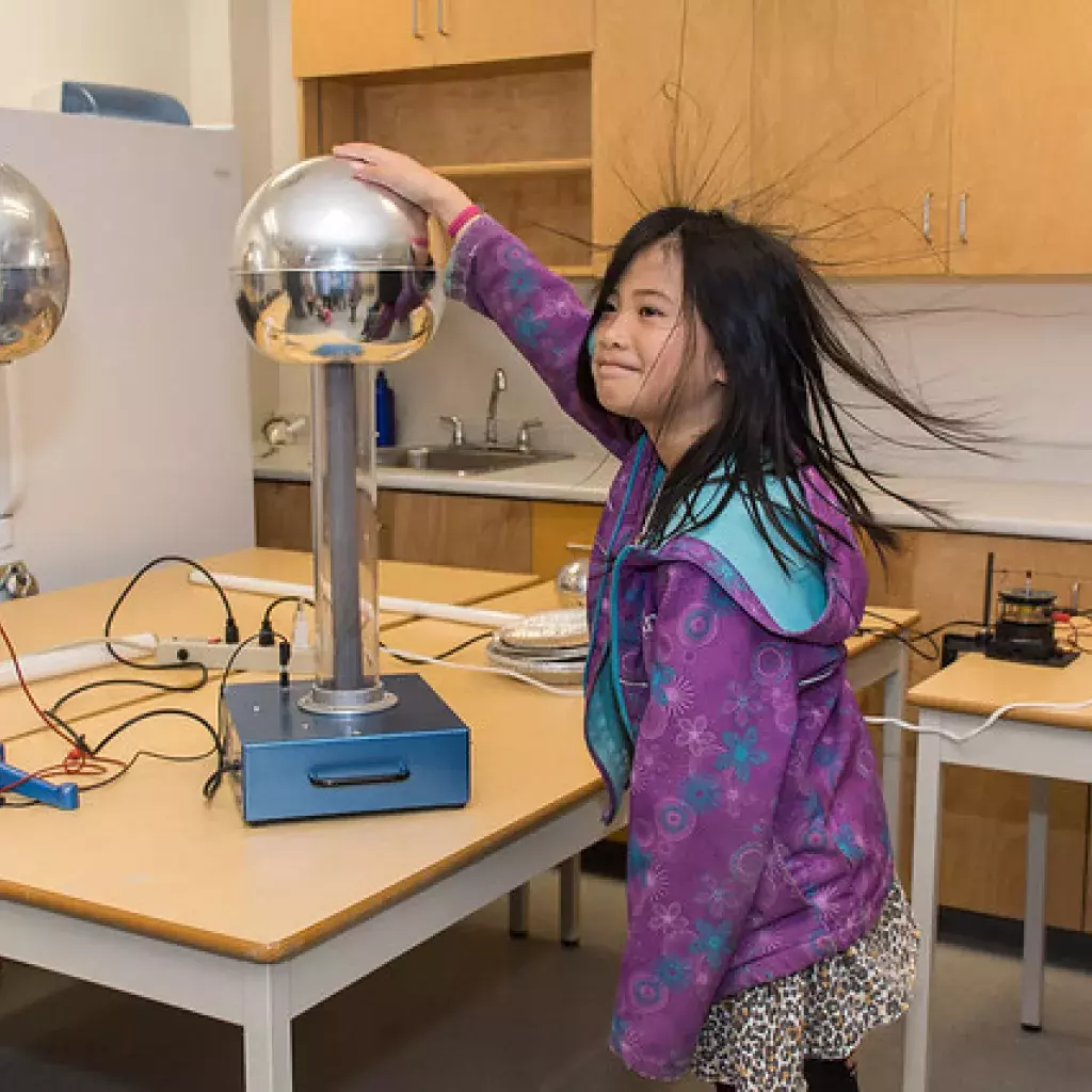 An attendee at Science Rendezvous at Kwantlen Polytechnic University Langley campus participates in experiment. 