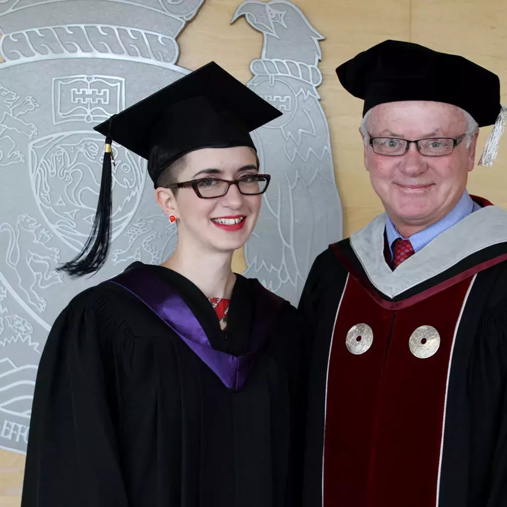 Seanna Schmuland with President and Vice-Chancellor Dr. Alan Davis at her convocation.