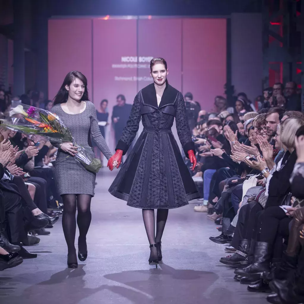 Nicole Boyer (left) walks down the runway with the model wearing her award-winning garment. [Photo credit: Geneviève Giguère]