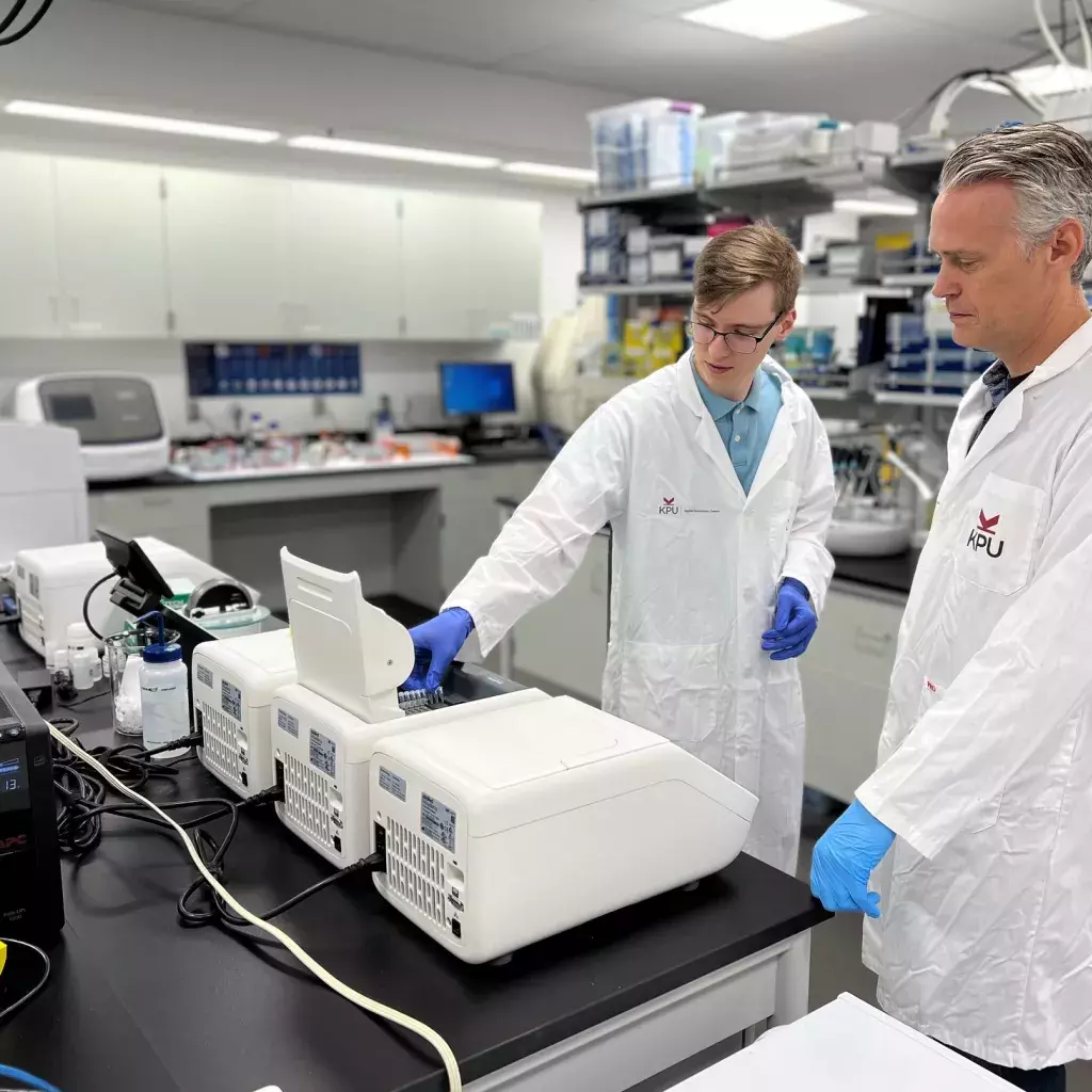 Dr. Paul Adams and Robert Wester using the Ion GeneStudio S5 System in KPU's Applied Genomics Centre.