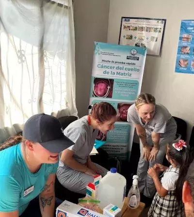 Nursing students welcome community members into the clinic.