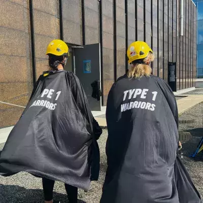 Lana and Natasha Mihell prepare to descend a 25-storey building in Vancouver