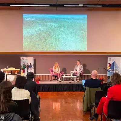 Dr. Maria Strack speaking with Dr. Brett Favaro at the President's Dialogue 